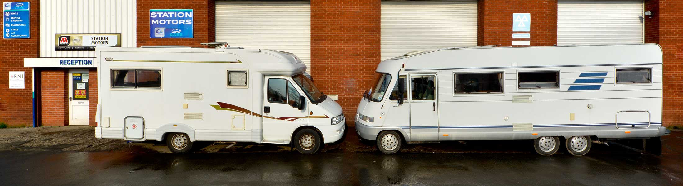 Two motor caravans parked outside the Station Motors reception