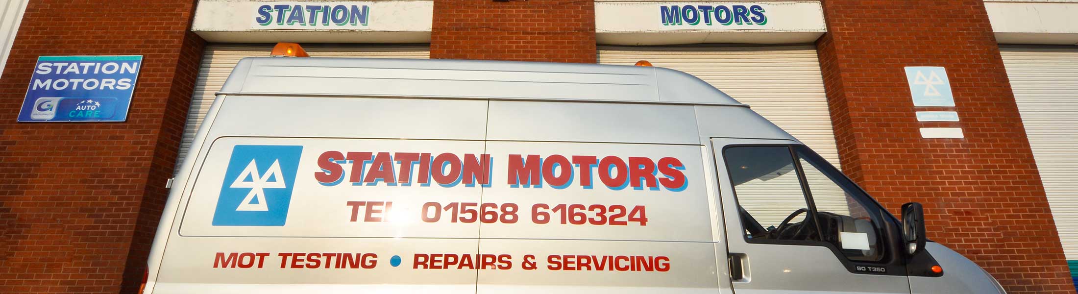 The Station Motors van, lettered MOT testing, repairs and servicing, outside the workshop
